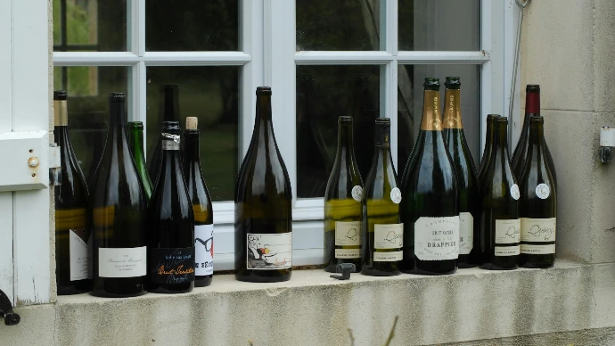 assorted wine bottles on cabinet